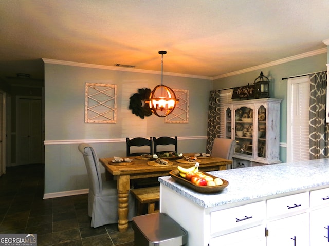 dining room featuring an inviting chandelier and crown molding