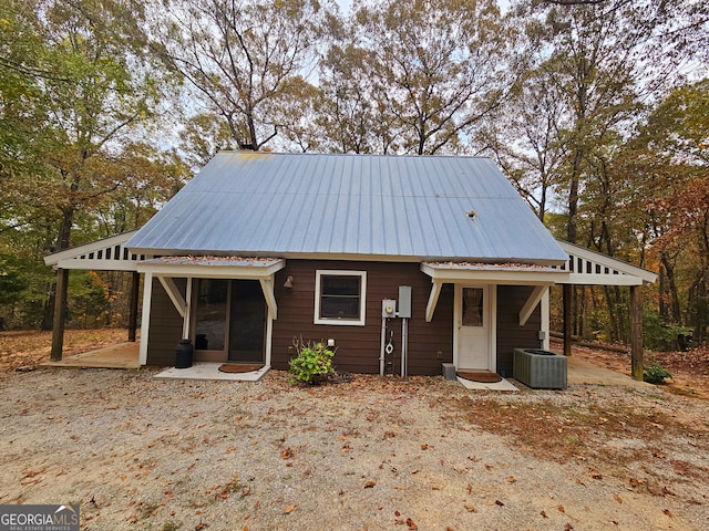 view of front facade featuring central AC and a patio area