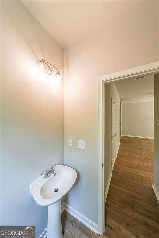 bathroom with sink and hardwood / wood-style floors