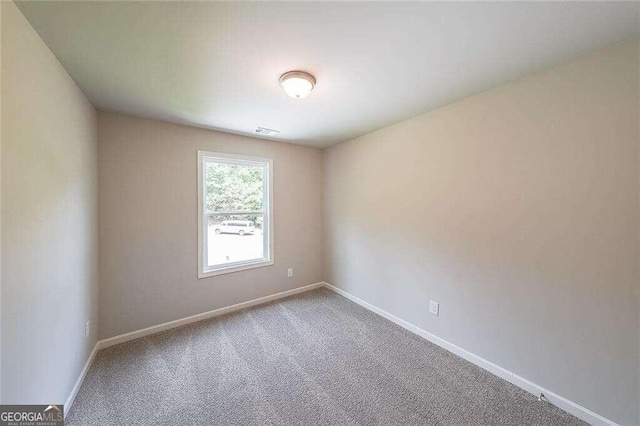 view of carpeted spare room