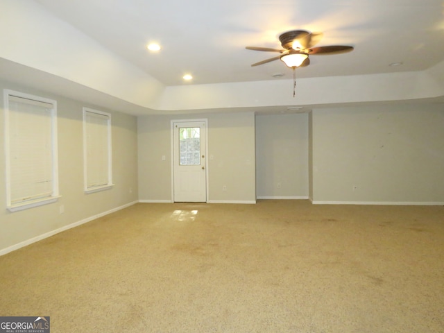 interior space featuring ceiling fan and carpet flooring