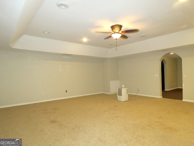 interior space with carpet floors and ceiling fan