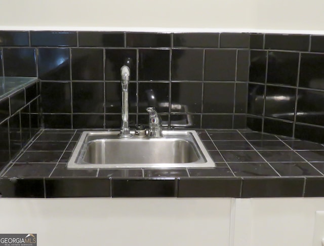 interior details with decorative backsplash and sink