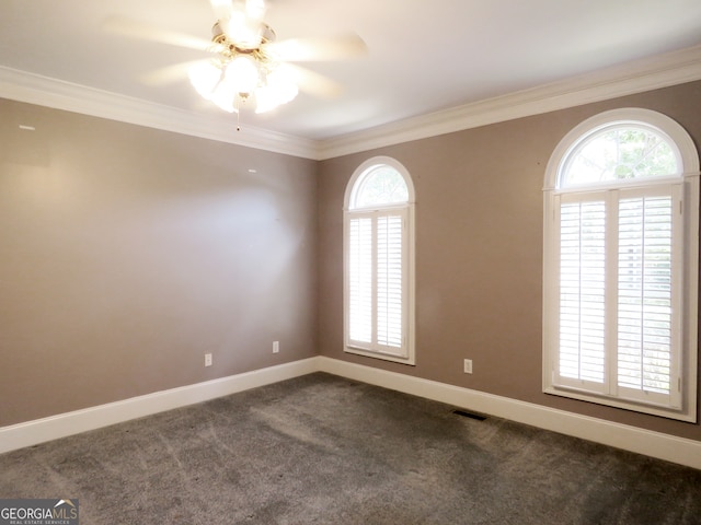 unfurnished room with crown molding, carpet flooring, and ceiling fan