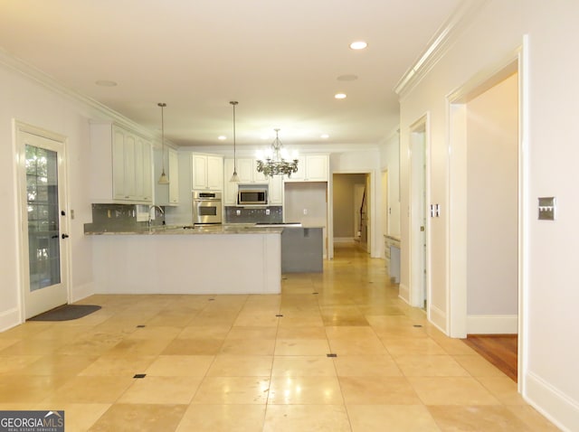 kitchen featuring kitchen peninsula, white cabinetry, light stone countertops, pendant lighting, and stainless steel appliances