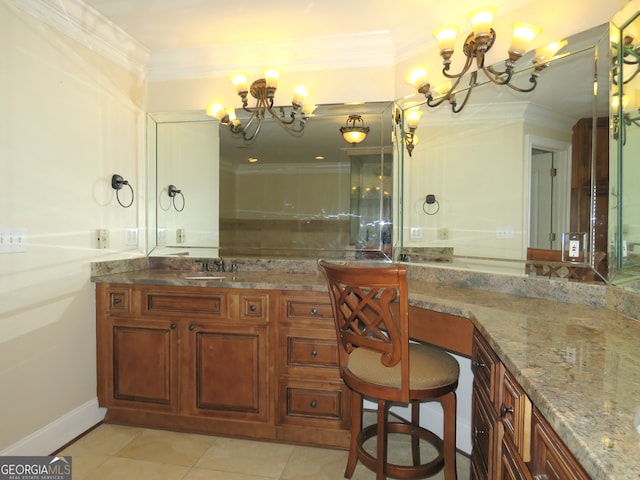 bathroom with a notable chandelier, tile patterned floors, ornamental molding, and sink