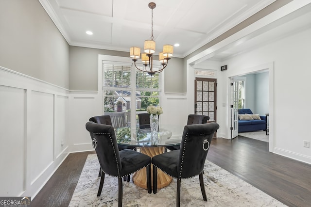 dining space with a wealth of natural light, dark wood-type flooring, and crown molding