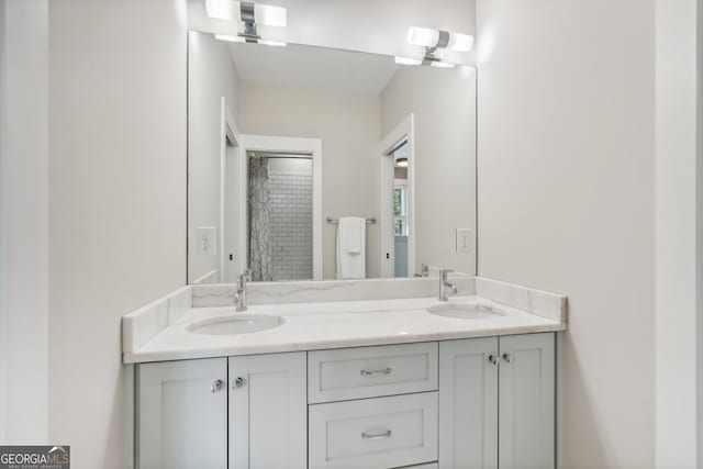 bathroom with vanity and a shower