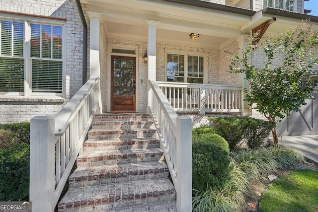 entrance to property featuring covered porch