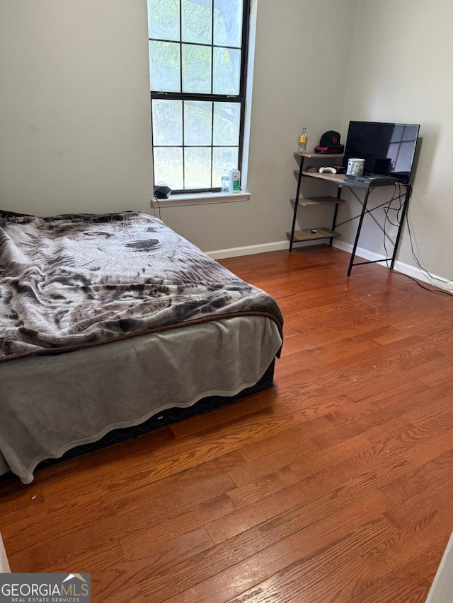 bedroom featuring hardwood / wood-style flooring