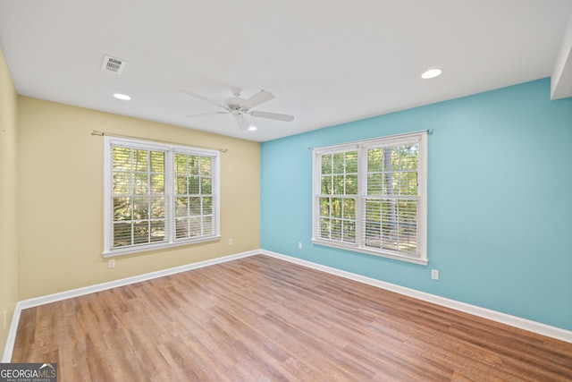 unfurnished room featuring light hardwood / wood-style flooring and ceiling fan