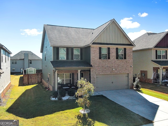 view of front of house featuring a front lawn and a garage