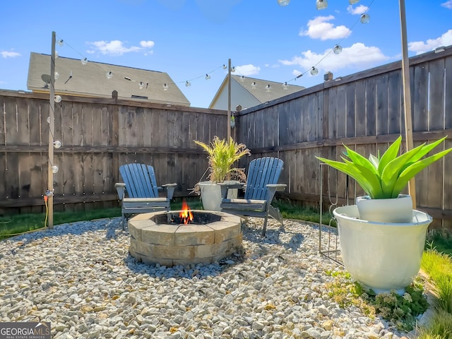 view of patio featuring an outdoor fire pit