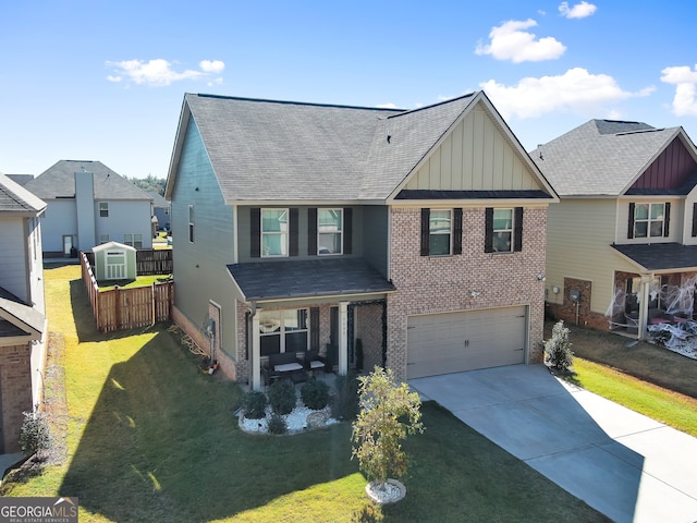 view of front of house with a garage and a front lawn