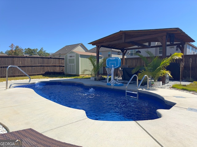 view of pool featuring a patio area and a storage unit