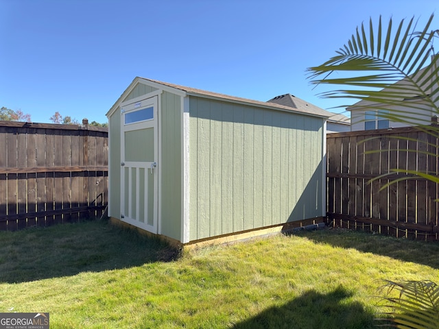 view of outbuilding with a yard