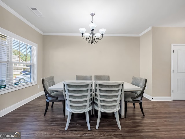 dining room with ornamental molding, a chandelier, and dark hardwood / wood-style floors