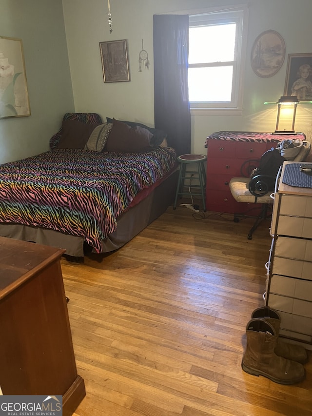 bedroom with light wood-type flooring