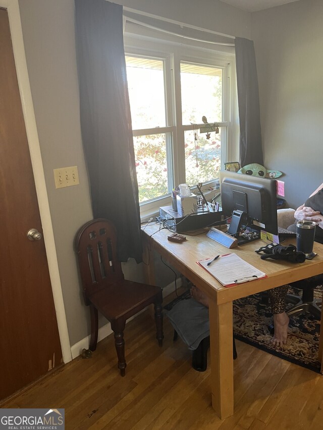 office area featuring hardwood / wood-style floors and a healthy amount of sunlight