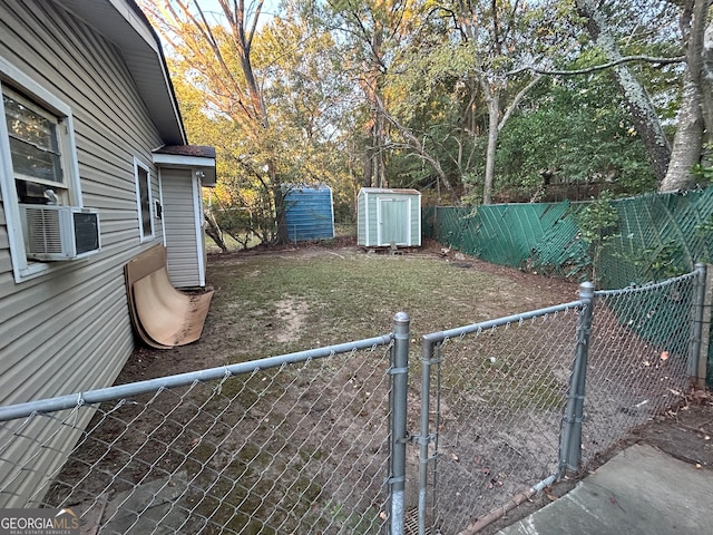 view of yard featuring a shed and cooling unit