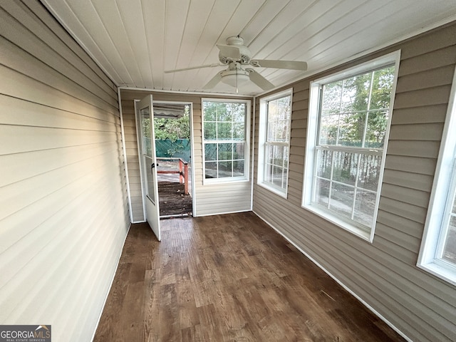 unfurnished sunroom featuring ceiling fan and wooden ceiling