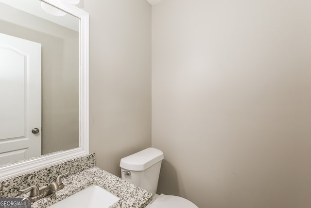 bathroom featuring sink and toilet