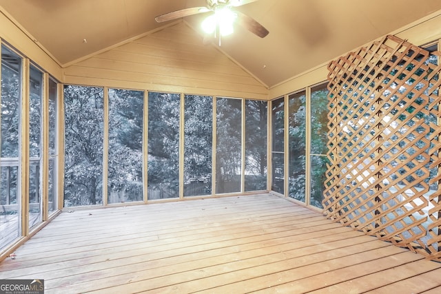 unfurnished sunroom featuring ceiling fan and vaulted ceiling