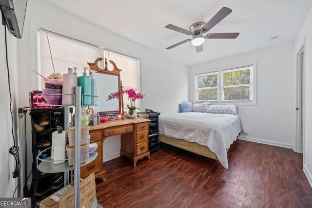 bedroom with ceiling fan and dark hardwood / wood-style floors