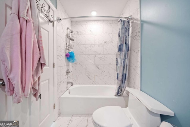 bathroom featuring shower / tub combo with curtain and toilet