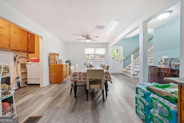 dining space featuring light wood-type flooring and ceiling fan