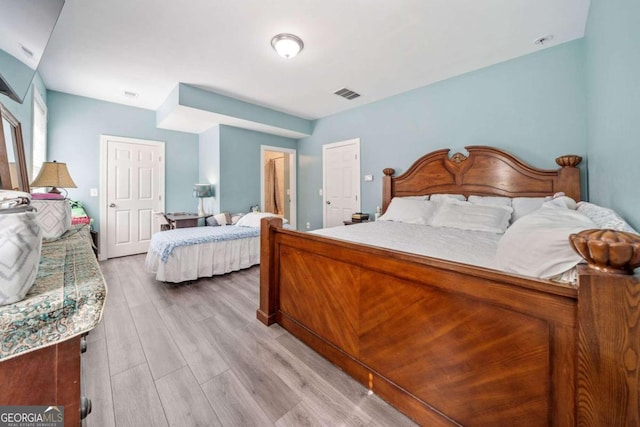 bedroom with light hardwood / wood-style flooring