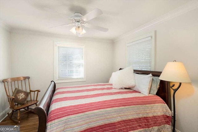 bedroom with crown molding, wood-type flooring, and ceiling fan