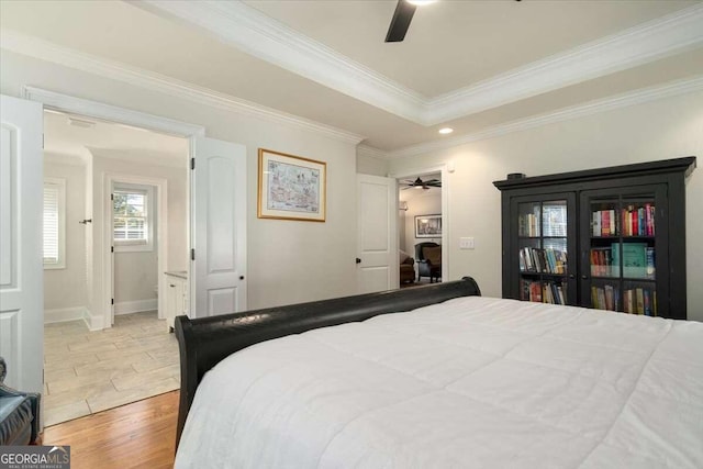 bedroom with ornamental molding, light hardwood / wood-style flooring, and ceiling fan