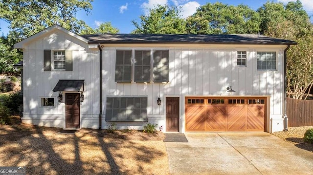 view of front of property with an attached garage and concrete driveway