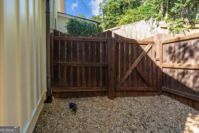 view of gate with fence