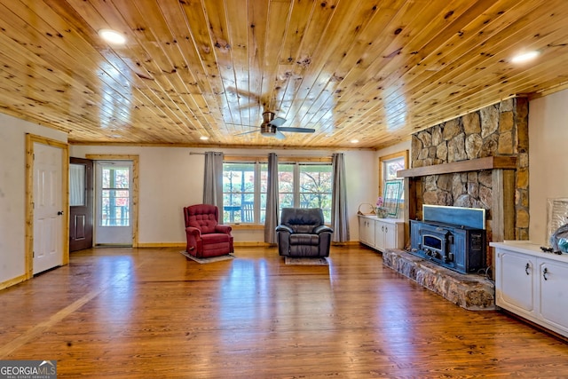 sitting room with wood ceiling, hardwood / wood-style flooring, a wealth of natural light, and ceiling fan