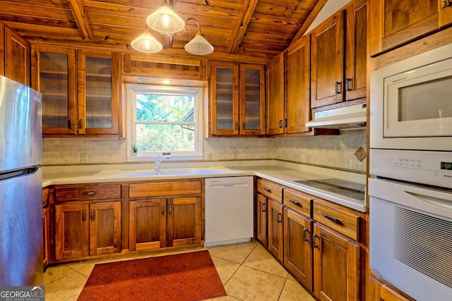 kitchen with light tile patterned floors, decorative light fixtures, white appliances, and wooden ceiling