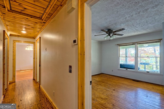 hall with light hardwood / wood-style floors