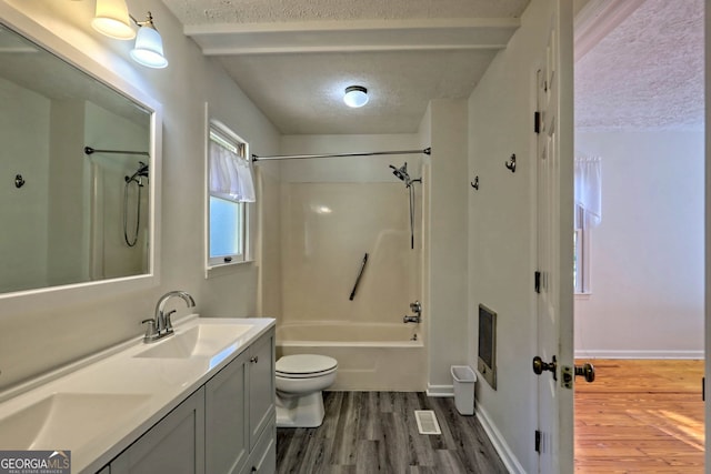 full bathroom with toilet, shower / tub combination, hardwood / wood-style flooring, and vanity