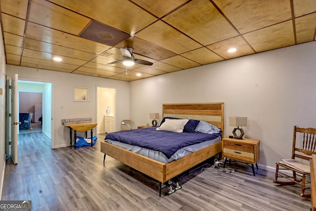 bedroom featuring hardwood / wood-style flooring and ceiling fan