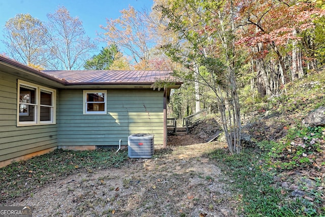 view of side of home with cooling unit