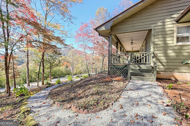 view of yard featuring a wooden deck