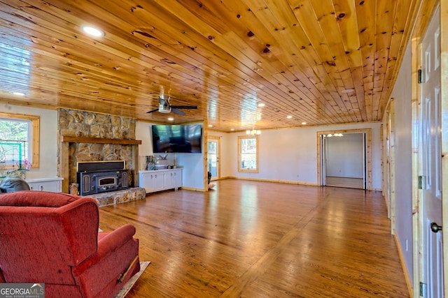 living room with wood ceiling, hardwood / wood-style flooring, and ceiling fan