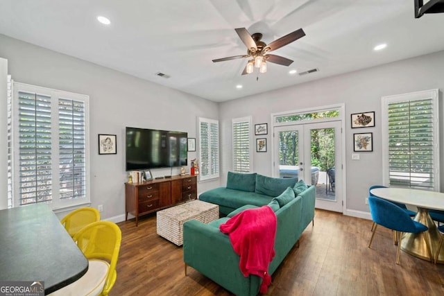 living room with a healthy amount of sunlight, french doors, and dark hardwood / wood-style floors