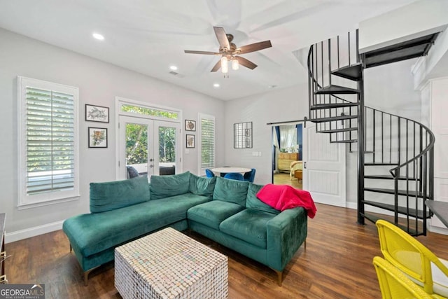 living room with ceiling fan, dark hardwood / wood-style flooring, and french doors