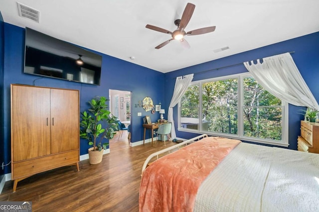 bedroom featuring ceiling fan and dark hardwood / wood-style floors