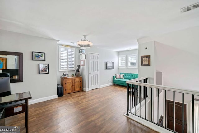 interior space featuring a healthy amount of sunlight and dark hardwood / wood-style floors