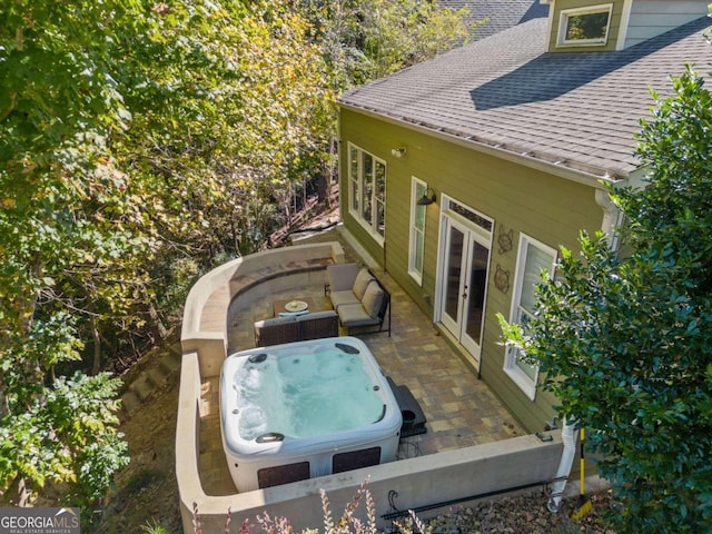 exterior space featuring french doors and a hot tub