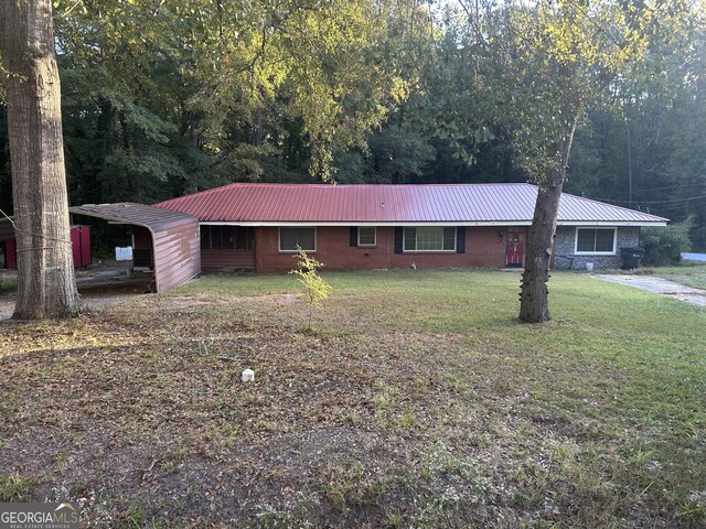 ranch-style house with a front yard