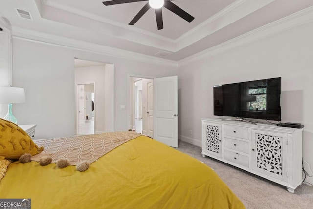 bedroom featuring ceiling fan, light carpet, ornamental molding, and a raised ceiling